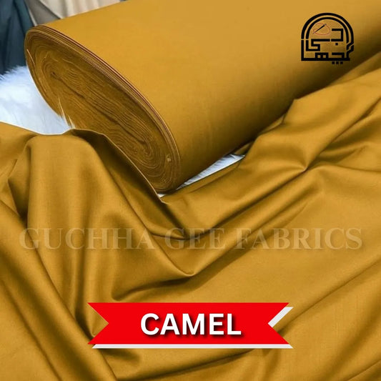 Roll of camel-colored fabric with 'Guchha Gee Fabrics' branding.